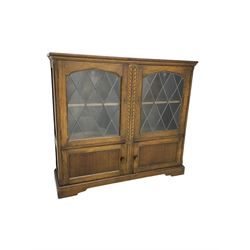 Early 20th century bookcase or cabinet, astragal glazed doors over two panelled cupboards (W108 D30 H97)