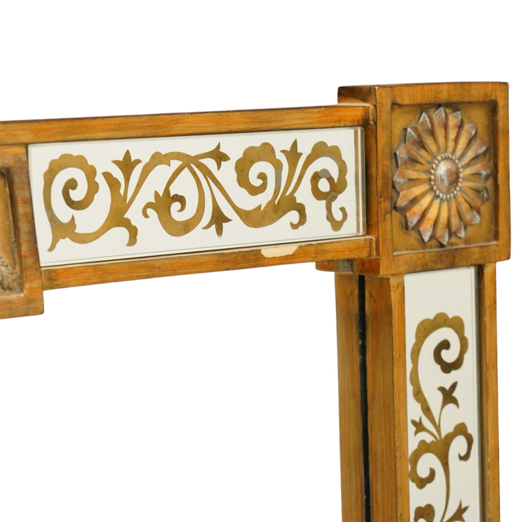 Regency inspired overmantel mirror, decorated with gilt foliate scrolls on the mirrored surrounds, flower and swag applied mounts