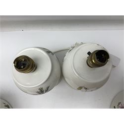 Two Portmeirion Botanic Garden table lamps, together with two Portmeirion Botanic Garden planters