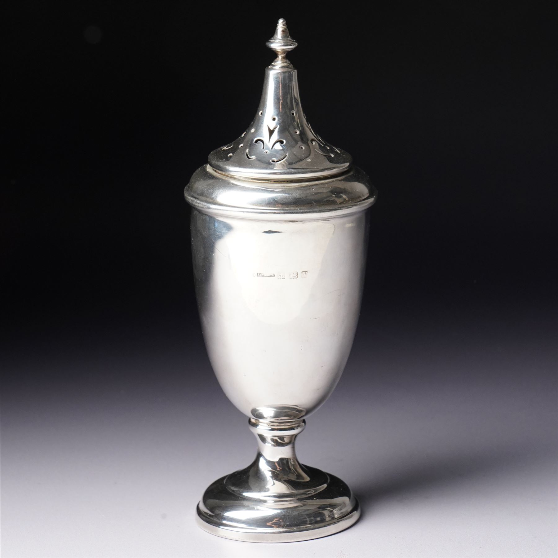 Silver vase shape sugar caster with pierced cover on pedestal foot Birmingham 1945 Maker S Blanckensee & Co Ltd