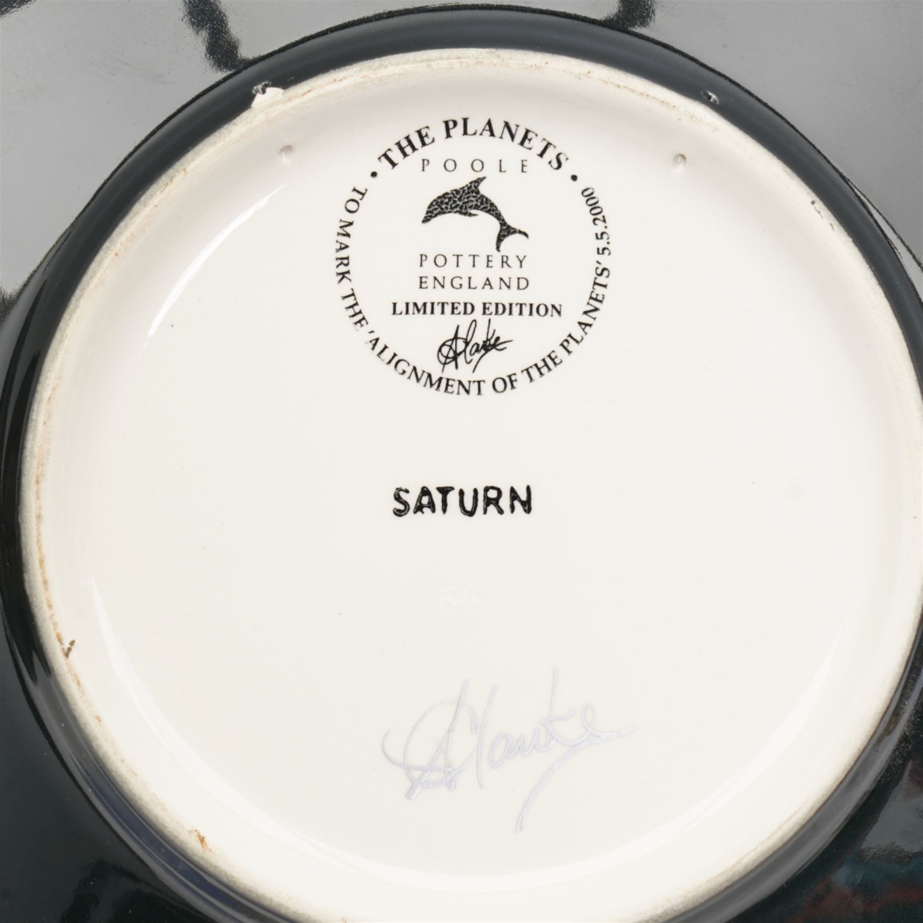 Poole Pottery Saturn Charger from the Alan Clarke 'The Planets' series, no. 1314/2000, D41cm, together with a Poole Pottery Millennium charger, no. 1035, and vase no. 1314, H34cm (3)