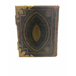 Late 19th/ early 20th Century family bible with coloured plates and gilt fittings and clasps.