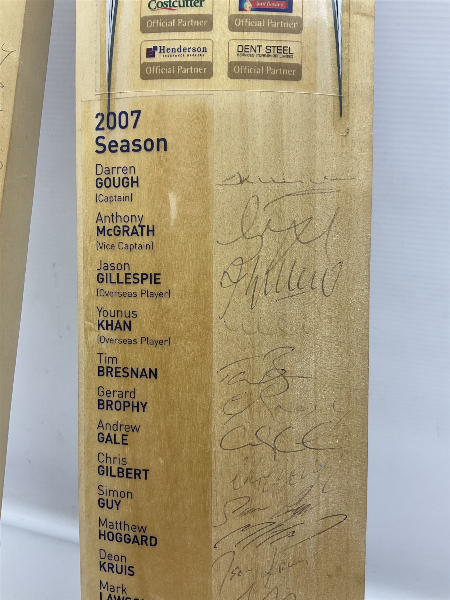 Two signed Yorkshire County cricket bats, from 2007 and 2008 seasons, bearing signatures including Darren Gough, Jason Gillespie, Younus Khan, Michael Vaughn and Tim Bresnan, etc