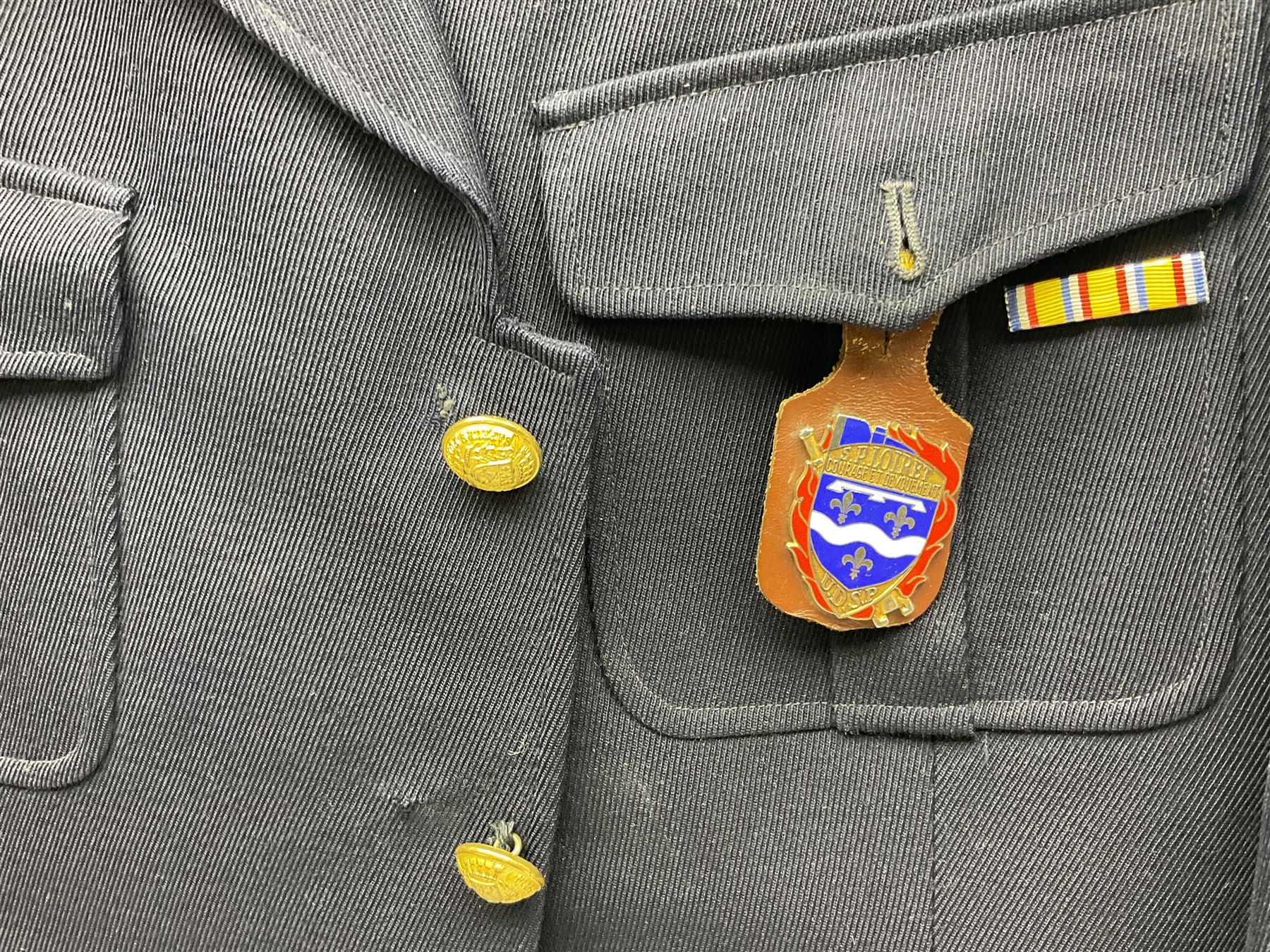 Mid 20th century French Ugeco Nantes first class dress navy blue uniform with ribbon bar with cap, and quantity of Sapeurs Pompiers patches, Sapeurs Pompiers de Caen belt buckle etc