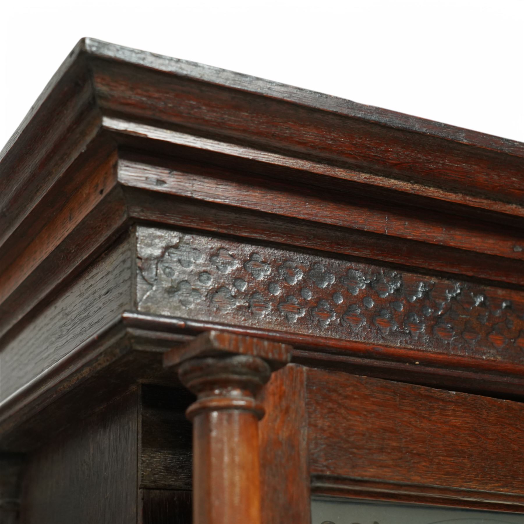 John Hancock of Yeovil (Sommerset) - oak cased 8-day longcase clock c1810, with a flat topped pediment, blind frieze and broad cornice, square hood door with attached wooden pilasters and capitals, long trunk door on a square plinth with applied skirting, painted dial with steel hands, gilt painted spandrels, Roman numerals, minute track and five-minute Arabic's, with seconds dial and date aperture, dial pinned via a falseplate to a rack striking movement, striking the hours on a bell. With weights and pendulum.