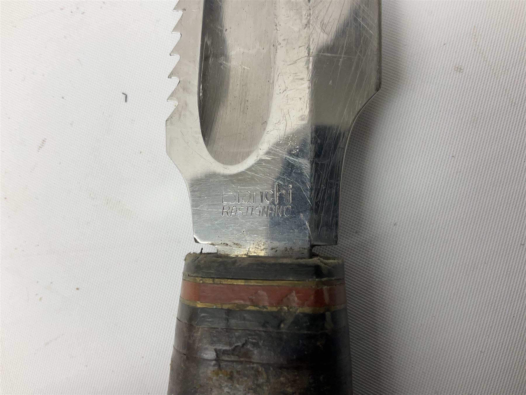 German ERN Wald-Solingen Art Deco style hunting knife with 13cm Bowie type blade and chrome fittings with antler grip; in leather sheath L24.5cm overall; and Bianchi Rastignano Aeronautica Militare combat knife with 15.5cm Bowie type saw-back blade and stacked leather grip (2)