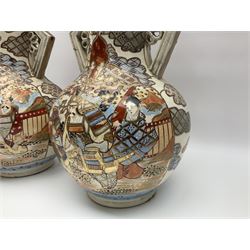 Pair of Japanese Satsuma vases decorated with four panels of figures in a landscape setting between patterned borders, character marks to the base, together with another pair of Satsuma vases and well bucket, largest vase H47cm