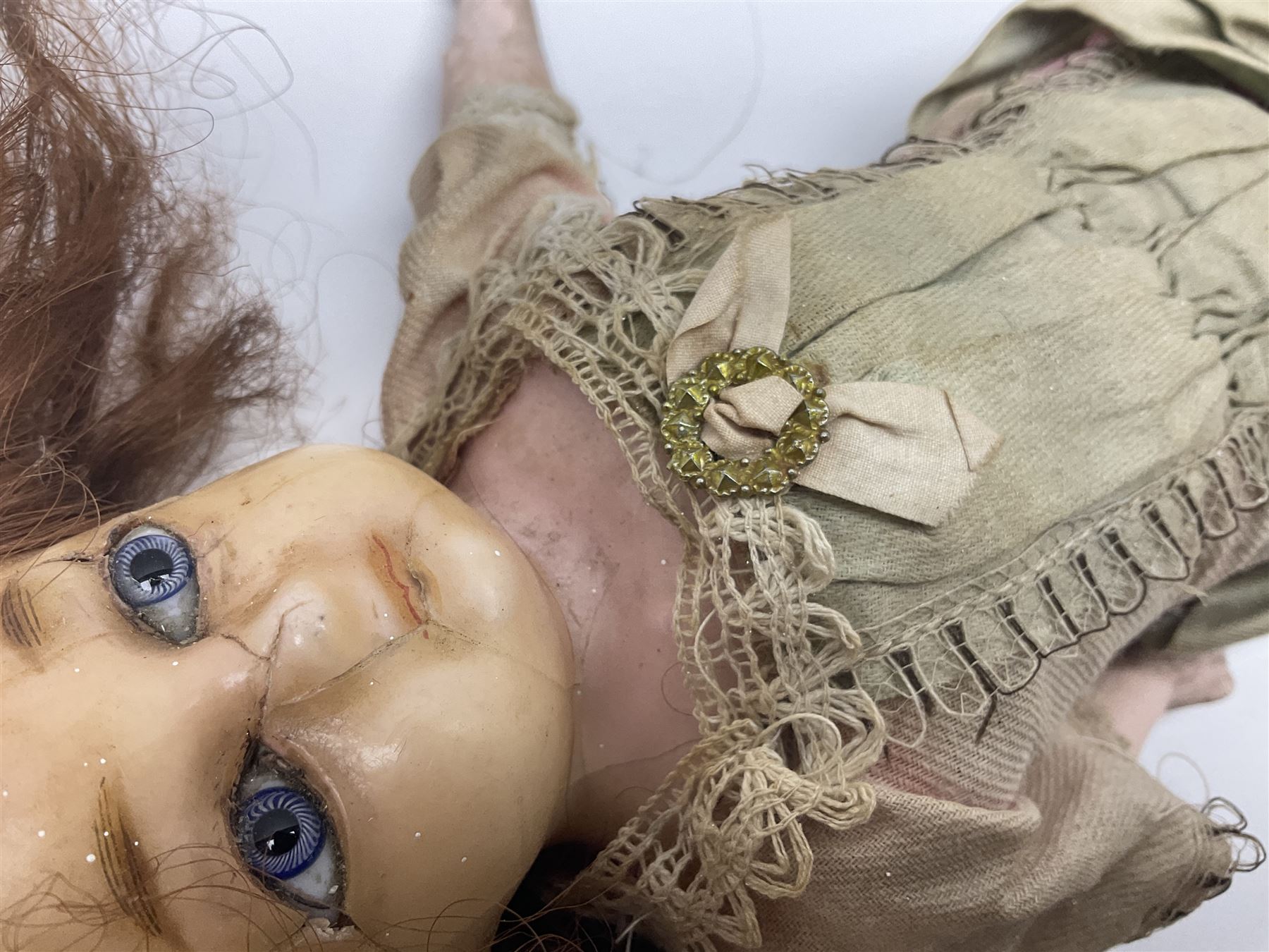 Victorian wax shoulder head doll with applied hair, inset glass eyes and jointed body with composition lower limbs; faded pink dress H35cm