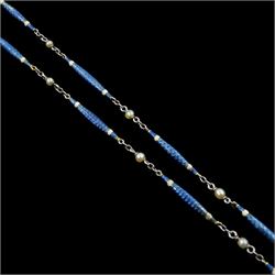 Early 20th century platinum enamel and pearl necklace, sixteen guillioche blue enamel and white enamel baton links, each spaced by a trace links and a single seed pearl