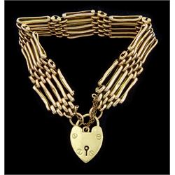 Early 20th century rose gold five bar gate bracelet, stamped 9ct, with later yellow gold heart locket clasp, hallmarked