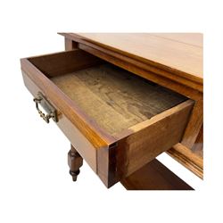 Victorian mahogany side table fitted with two drawers,  rectangular top over two short drawers with moulded facias and brass drop handles, turned front and rear supports joined by an open undertier, on turned feet 