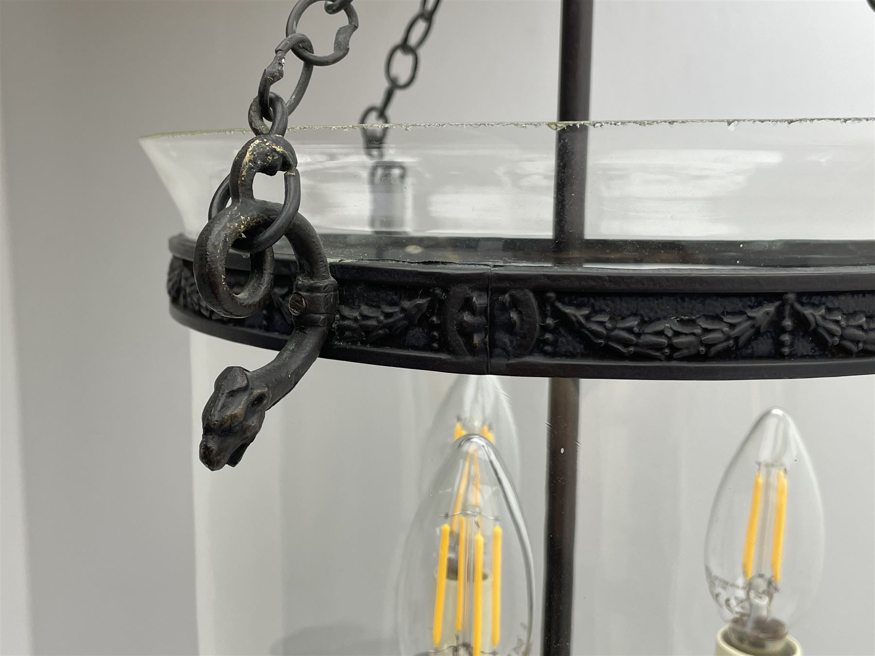 Vaughan Designs - Regency design bronzed metal and glass hall lantern, three branch light in glass bell, the band decorated with bell flower garlands and serpentine mythical beast chain brackets