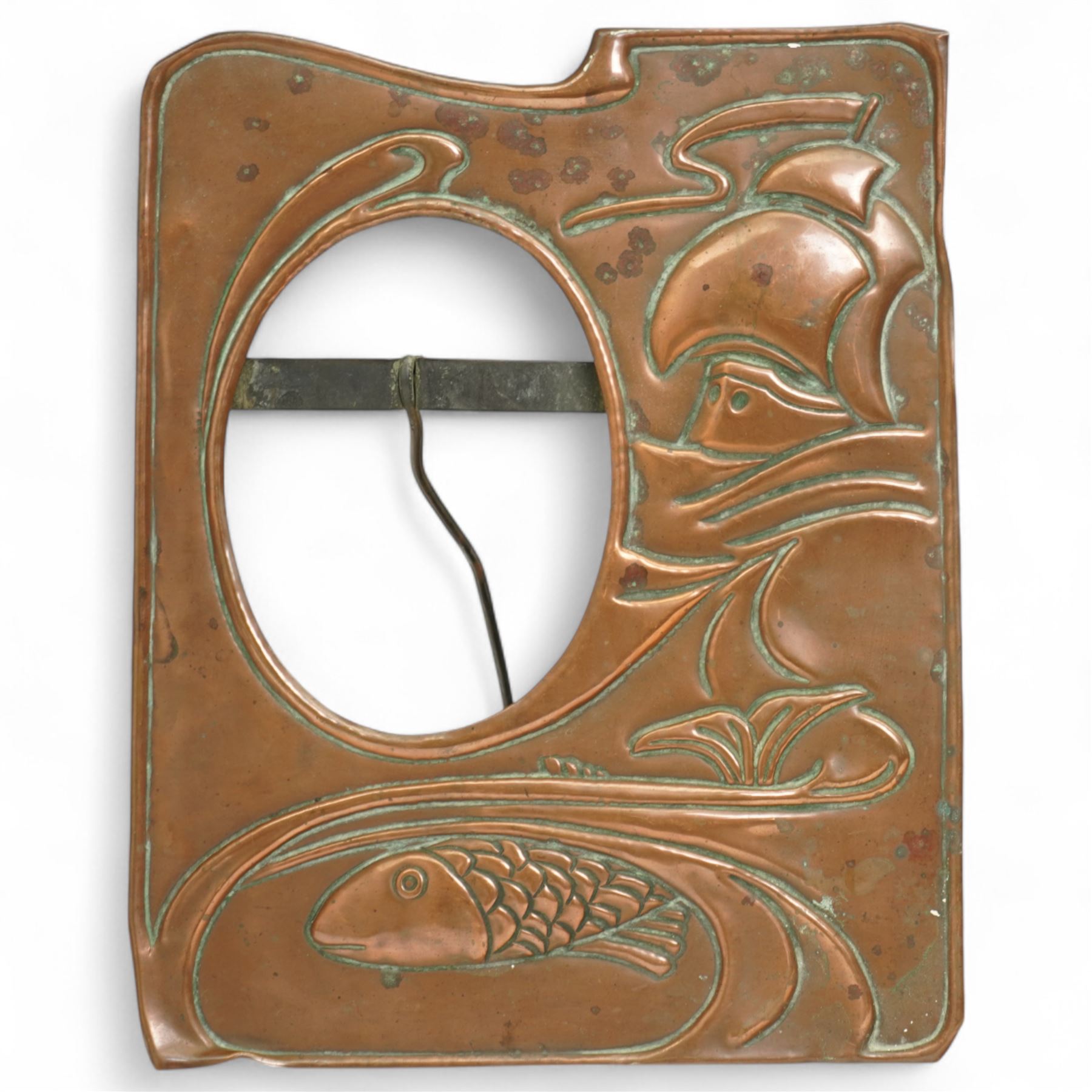 Newlyn type Arts and Crafts copper photograph frame decorated with a fish and galleon 24cm x 20cm with oval aperture and two other Newlyn style beaten copper frames (3)