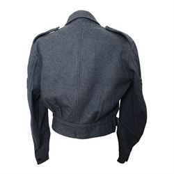 WWII Royal Air Force battle dress blouse, belonging to Flight Sargent Colin Scott 3011422, dated 1945, tailors label for M & N Horne Ltd 1945, Size No 7, blue cloth, Signaller cloth brevet, wireless officers patch to right sleeve and braid sergeant stripes to both sleeves, together with his flight log book, postings & Movements, Royal Air Force Service and Release Book, photographs etc  