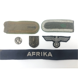  WW2 German badges and insignia including officer's tunic eagle, Afrika cuff title, two shoulder boards (one probably Afrika Corps) and two metal badges (6)  