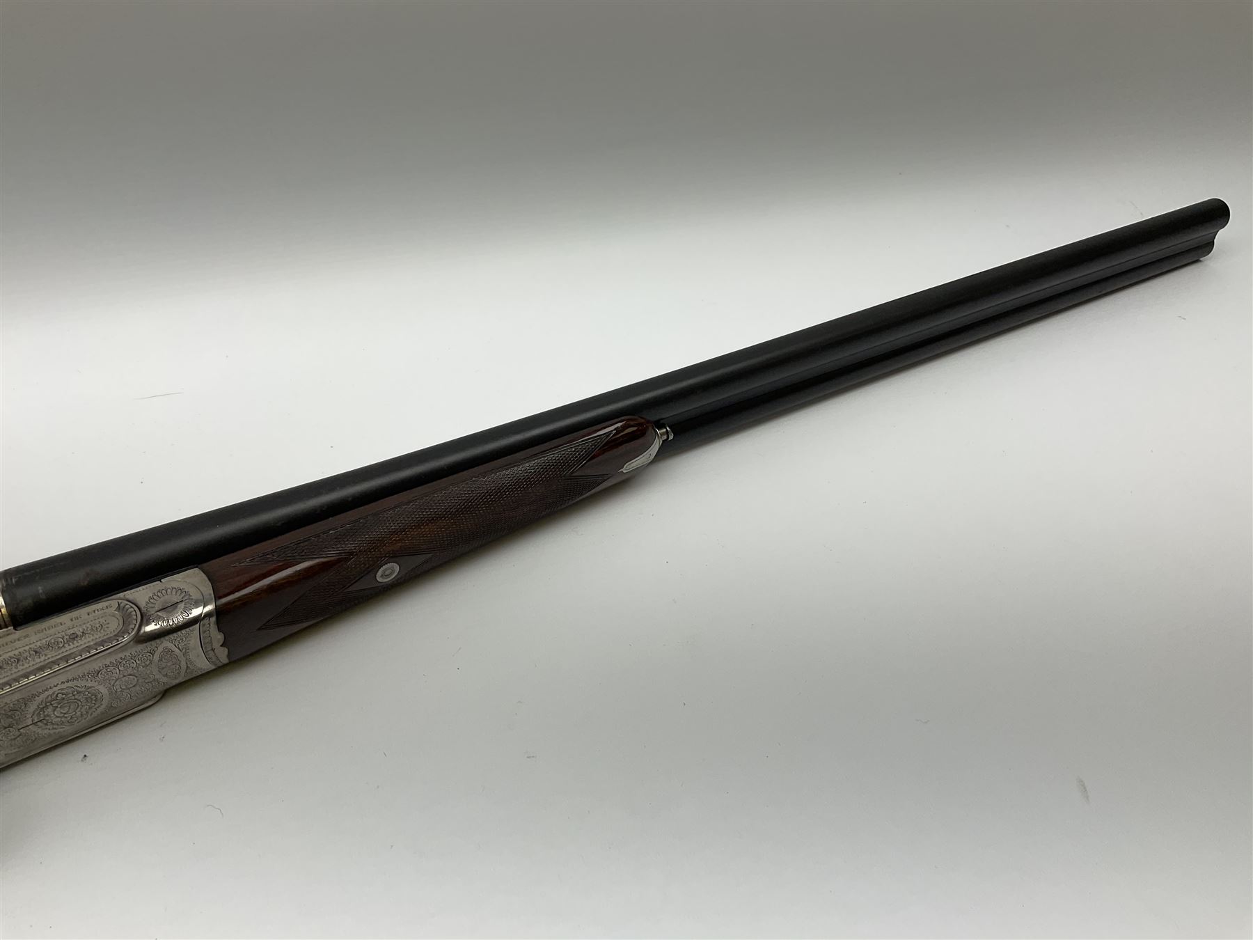 Gunmark Silver Sabel De Luxe 12-bore side by side double barrel side lock ejector sporting gun, 68.5cm barrels with 2.75cm chambers and matt bluing, walnut stock with chequered grip and fore-end and thumb safety, serial nos.12509 & 100.085, L111.5cm overall SHOTGUN CERTIFICATE REQUIRED
