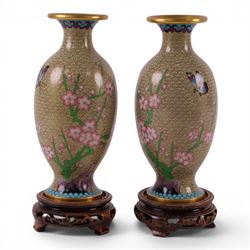 Pair of Cloisonné vases decorated with cherry blossom and peonies, upon a carved hardstone...