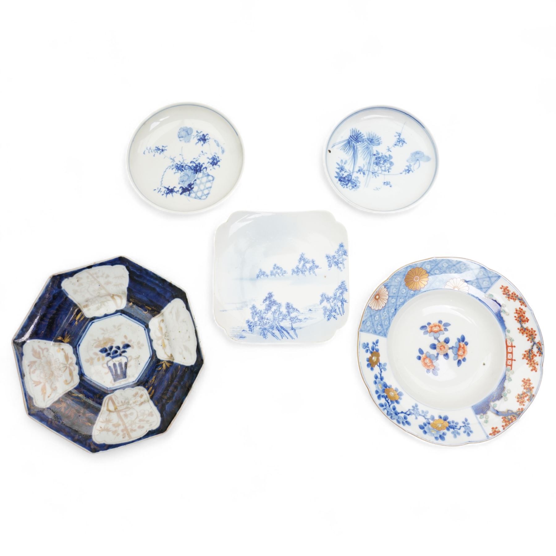 Japanese Edo period hexagonal dish with gilt decoration, Japanese porcelain to include a Seto blue and white dish, of square lobed form, four character mark to base, W18cm, Meiji Fukagawa Koransha imari circular dish on three ball feet, orchid mark to base D23cm, together with a matched pair of 19th century blue and white saucers, D16.5cm (4)