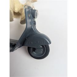 Mettoy friction drive Lambretta scooter no. 8134, the blue plastic scooter with cream handlebars and clear windshield, the rider with cream hat and clothing, stamped MTY 143 to front mud guards, in original box