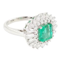 18ct white gold Colombian emerald and diamond cluster ring by Iliana, single octagonal cut emerald of 1.65 carat, surrounded by two rows of round brilliant cut and tapered baguette cut diamonds, hallmarked