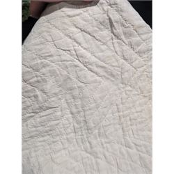 Handmade large patchwork quilt bedspread made up of individual squares of multi-coloured cottons and backed in a cream cotton, 243cm x 284cm 