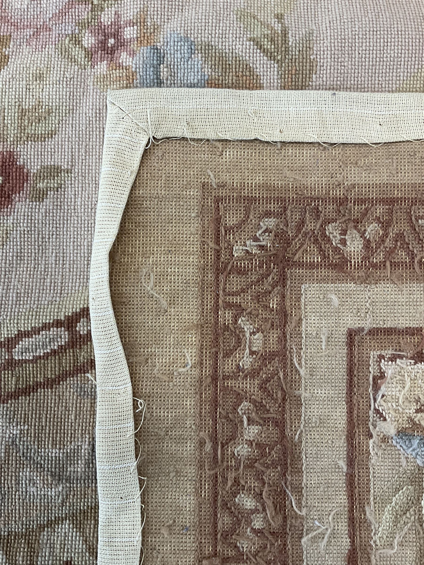 Late 20th century French style needle work Aubusson rug, circular field decorated with floral garlands and flower head motifs, multi-band border