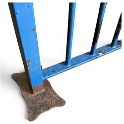Two sections of painted iron garden or estate boundary railing, comprising a 19th century wrought iron section with graduated spearhead uprights, together with a later hoop-top section with ball-finial end posts, both in blue painted finish