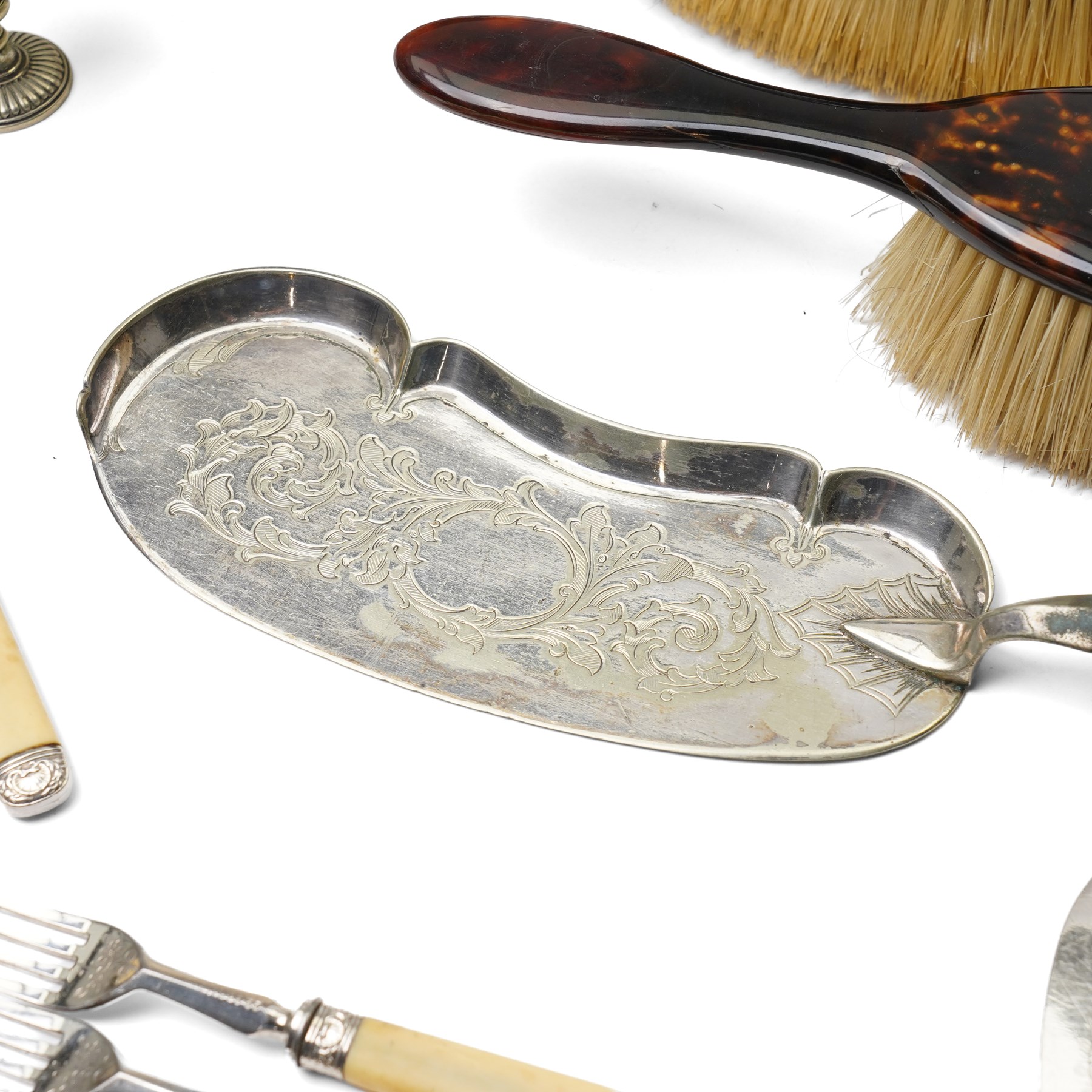 Silver plated egg boiler with bird finial, plated cocktail shaker, plated table bell, pair of tortoiseshell brushes' plated dessert knives and forks and other items 