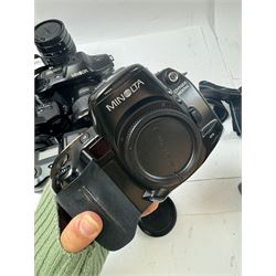 Six Minolta Dynax SLR camera bodies, comprising 800si serial no. 62703606, three 7xi examples, including one boxed example, serial nos. 20106944, 16123311 & 22107553, and two 9xi examples, serial no. 18209901 & 18202113, with three Minolta lenses, including Zoom xi 28-105mm 1:3.5(22)-4.5 lens, AF Zoom 28-85mm 1:3.5 (22)-4.5 lens and an AF Zoom 75-300mm 1:4.5(32)-5.6 lens, Hama carry case and other accessories