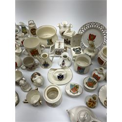 Collection of W.H. Goss crested ware including Oriel vase, Newcastle jug, and Wallingford Arms jug, other crested ware including Barnsley cheese cover and dish, Taunton fish, Scarborough puzzle jug, Wakefield phone box,  Bridgnorth chair, Bristol bird, Dawlsih trinket box, etc.  