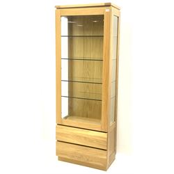 Solid light oak glazed display cabinet, fitted with two base drawers