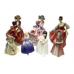 Seven Royal Doulton figures comprising two 'Top O' the Hill', 'Fair Lady (Red)', 'Diana', 'Marie', 'Babie' and 'Mandy' (7)