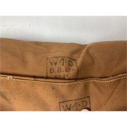 WW2 British Army RAMC 'Regimental Medical Pannier', well marked externally and dated 1941, stamped May 1943 internally, canvas covered wicker form with leather edges, hinged top and fall front with two rope carrying handles, fitted iron locking straps with securing chains; contains various unused field dressings and bandages with WW2 dates and two pillows; original label under lid L79cm