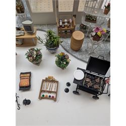 1:12 scale dolls house conservatory and garden accessories, including white wooden glazed conservatory on a stone effect base, black and white metal garden seating, barbecue, plant shelves, parasol, barbeque accessories, large planters, rabbit hutch, animals, chimenea, etc