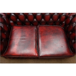  Two seat Chesterfield sofa upholstered in deeply buttoned ox blood leather, W157cm, D88cm  