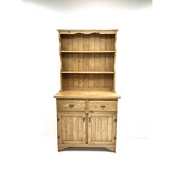 Pine dresser, two shelve plate rack, above two short drawers and two cupboard doors 