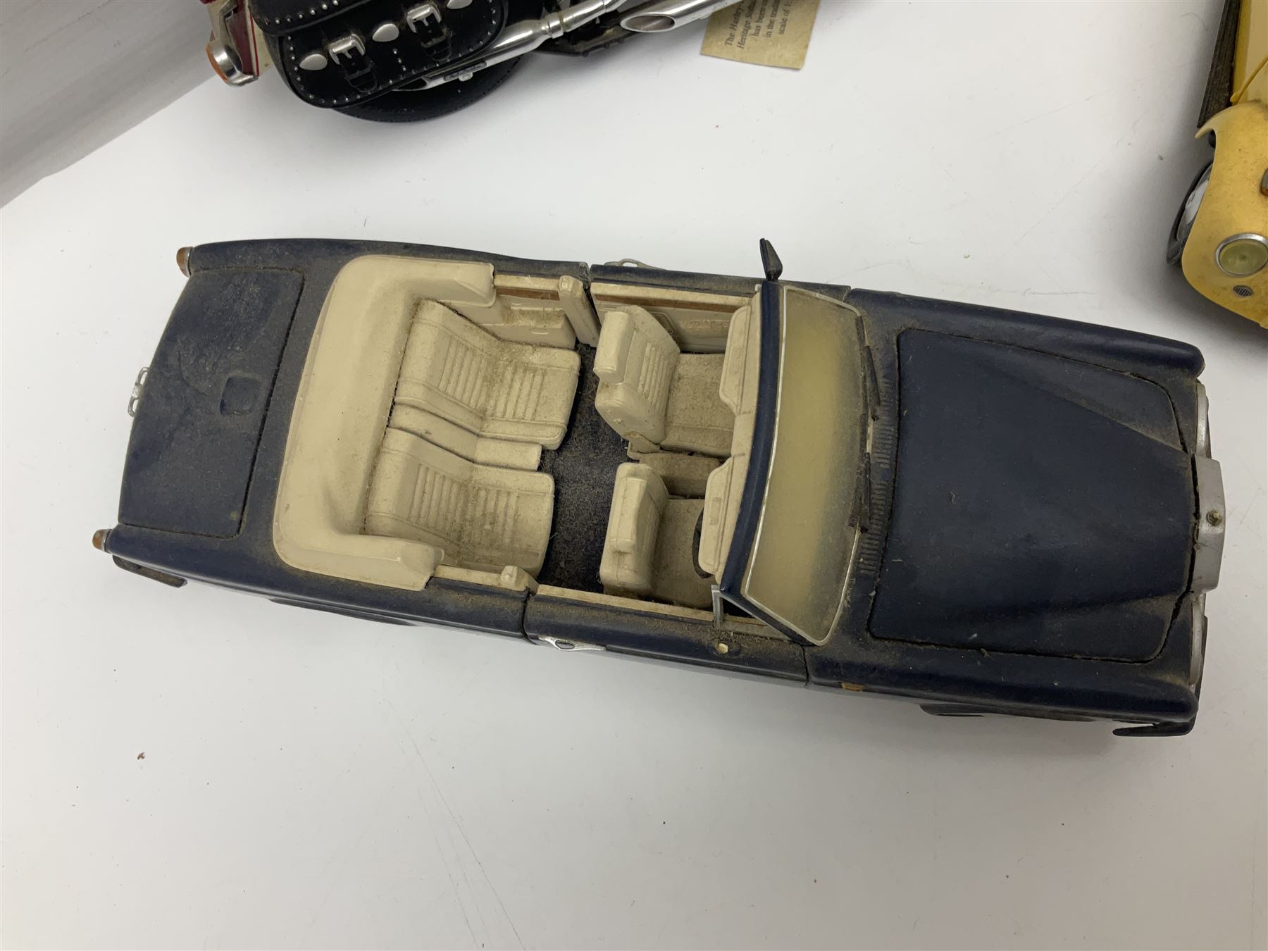 Franklin Mint - three die-cast models comprising 1:10 scale Harley Davidson Heritage Softail motorcycle, 1:24 scale 1957 VW Beetle and 1:24 scale 1993 Rolls Royce Corniche IV; all unboxed (3)