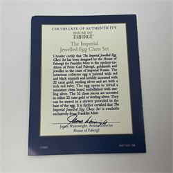 Franklin Mint House of Faberge; The Imperial Jeweled Egg Chess set, the egg opening to reveal a chess board, with a draw to the hexagonal base holding the miniature chess pieces, H23cm 