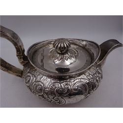 George III Irish silver teapot, of squat circular form, the body with repousse and chased floral and C scroll decoration, with capped C handle and ivory insulators, engraved to base 'Presented to Troop Sergeant Major John Percival, of the 4th Dragoon Guards by Alex D. Tait, Esq, late Captain in that corps as a mark of approbation of his steady and upright conduct when Sergeant Major of his Troop, Dublin, June 2nd 1843', hallmarked William Law, Dublin 1817, H12.5cm, This item has been registered for sale under Section 10 of the APHA Ivory Act