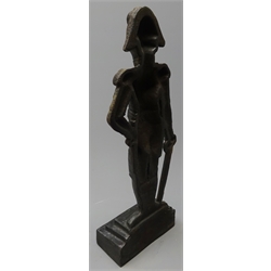  Cast iron fireside figure of Wellington depicted standing resting on his sword, on stepped base H41cm  