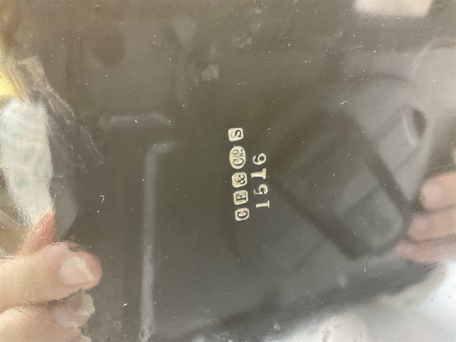 Oval silver plate twin handled tray, egg and dart edge, engraved with floral springs surrounding an central inscription, L65cm