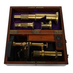 19th century brass monocular microscope by Hartnack & Prazmowski, in fitted case incscribed David Marr London, with two eyepieces, together with two further brass monocular microscopes