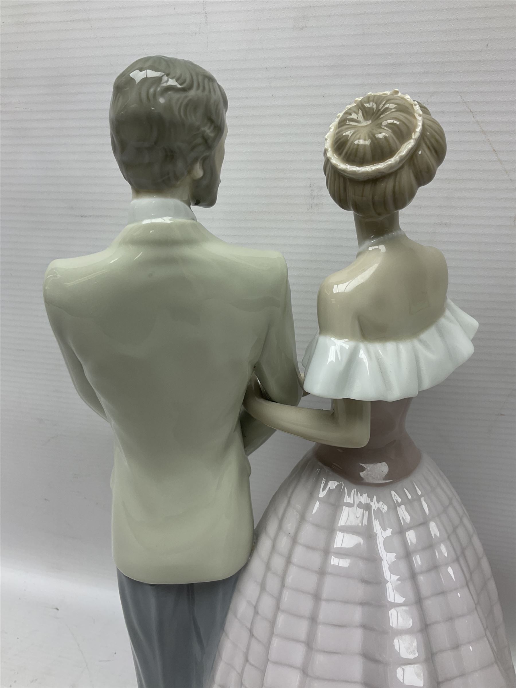 Lladro figure, An Evening Out, modelled as a man and women in evening dress, no 5540, year issued 1988, year retired 1991, H32cm
