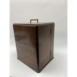 19th century mahogany travelling apothecary cabinet, with recessed brass carry handle to top, and two deep-section hinged doors to the front opening to reveal a fitted interior with clear glass bottles and two drawers, H27cm