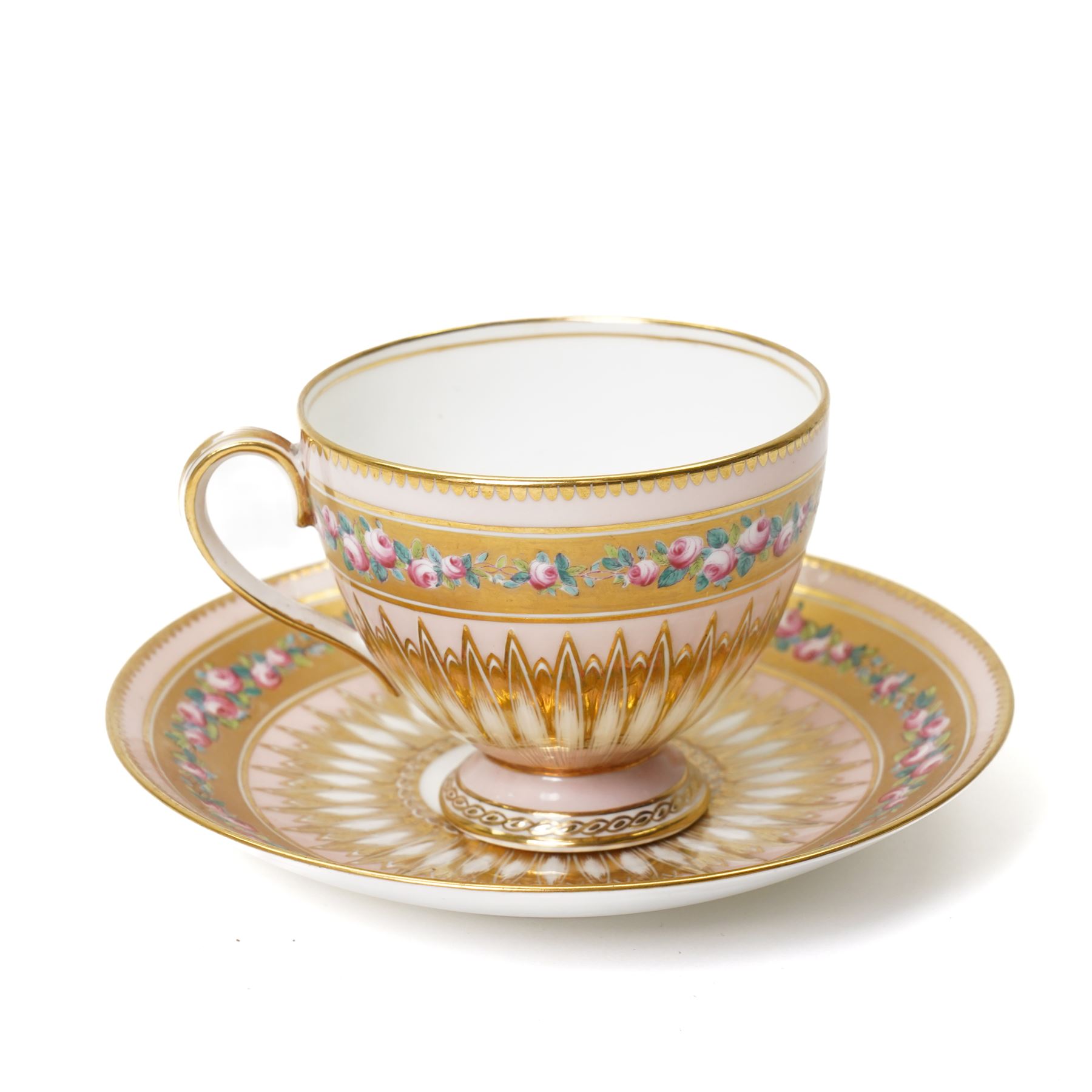 Brown-Westhead, Moore & Co cabinet cup and saucer, with rope twist moulded handle, hand-painted with floral reserves against a white and sky blue ground, heightened profusely with gilt, together with a pink hand-painted example, and a 19th century spill vase and twin-handled covered sucrier (4)
