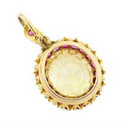 Gold yellow sapphire and ruby pendant, single cushion cut sapphire of approx 10.20 carat, surrounded by nineteen round cut rubies and ruby set bail