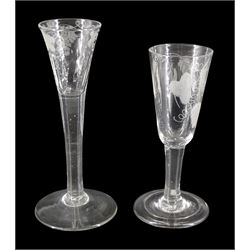 Two mid 18th century drinking glasses, the first example with part fluted drawn funnel bowl engraved with fruiting vines upon a plain stem and conical foot, H17cm, the second example with funnel bowl engraved with barley and hops upon a plain stem and folded circular foot, H15cm