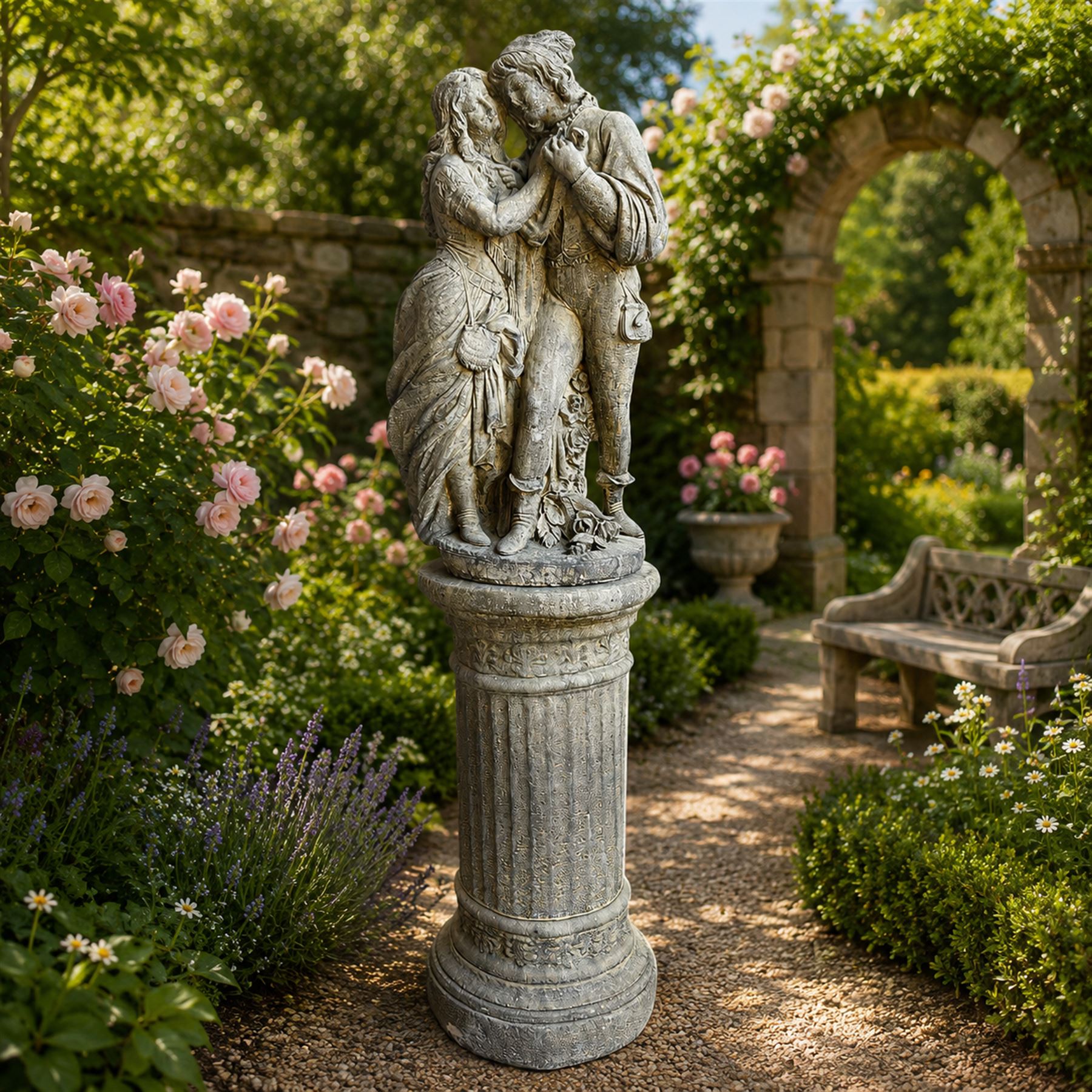 Composite garden statue group of Romeo and Juliet embracing, the couple adorned in Medieval dress standing on a naturalistic base with fallen flowers, raised on a Neoclassical fluted pedestal with Anthemion leaf motifs