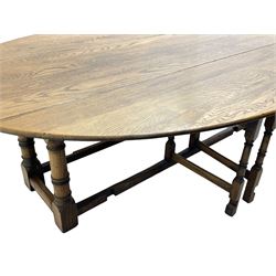 Large 18th century design oak wake or dining table, oval drop-leaf top, turned supports with double gate-leg action base, united by moulded stretchers 