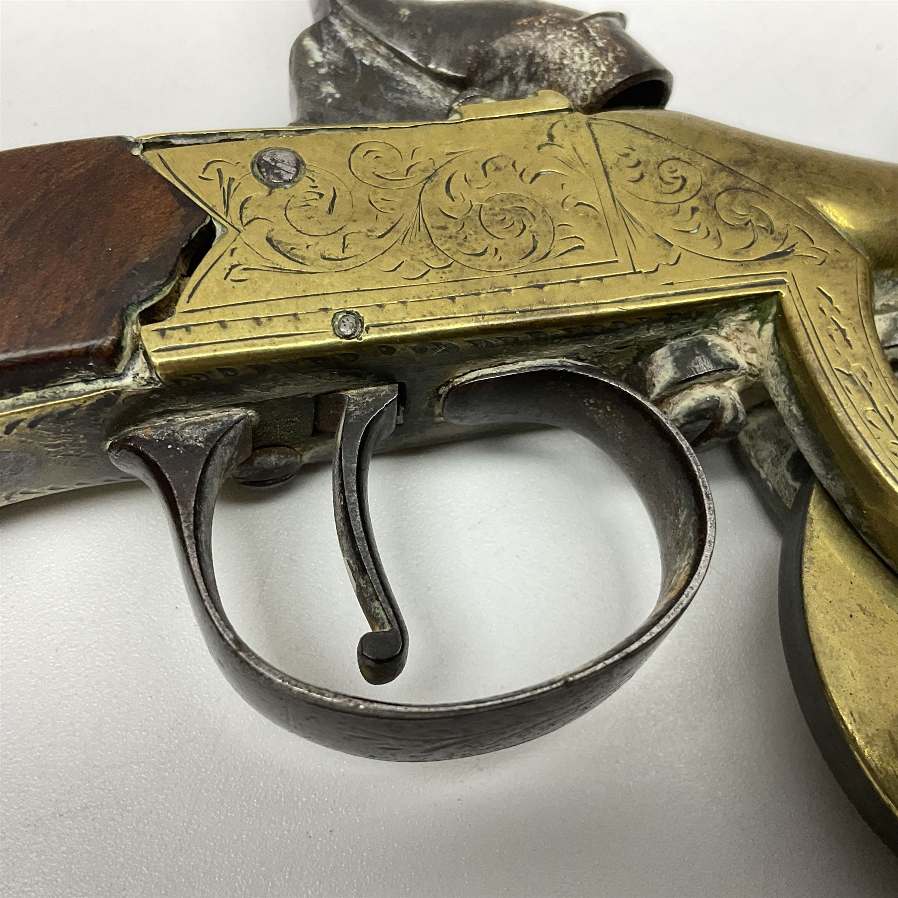 19th Century percussion eprouvette or gunpowder tester, with foliate engraved brass box lock and calibrated ratcheted wheel, steel trigger guard and walnut bag butt, L14cm